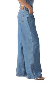 This take on '90s dad jeans is cut from medium-wash nonstretch denim with extraroomy wide legs that are meant to be worn stacked at the hem. 32" inseam; 26" leg opening; 11" front rise Zip fly with button closure Five-pocket style 100% cotton Machine wash, tumble dry Imported Dad Jeans, Cause And Effect, Wide Legs, Levi's, Meant To Be, High Waist, Wide Leg, Nordstrom, High Waisted