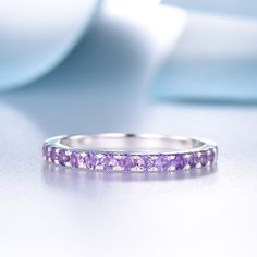 This is an amethyst ring. Stone: *Half eternity 2mm Natural amethyst. Custom Order *The main stone can be other gemstones you can imagine,any birthstone can be made.Please contact me if you need this service. *Any size *I can also design the matching band. Other *Rush order *Engraving *Payment plans *Please feel free to contact me if you need the above service. Processing Time *Handmade jewelry normally needs 2-3 weeks to finish,For some special one it may need 1-2 months. Return Policy 30 days Purple Half Eternity Ring For Anniversary, Purple Sapphire Promise Ring In Fine Jewelry, Round Purple Amethyst Ring For Promise, Purple Sapphire Ring For Promise, Elegant Purple Stackable Birthstone Ring, Purple Amethyst Promise Ring In Fine Jewelry Style, Elegant Purple Gemstone Stackable Rings, Purple Tanzanite Ring With Prong Setting, Fine Jewelry Purple Amethyst Ring With Prong Setting