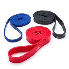 four different colors of yoga straps on a white background with one red, one blue and one black