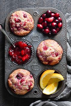 muffins with cherries and lemon on a tray