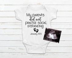 a white baby bodysuit with the words, my parents did not practice social distancing