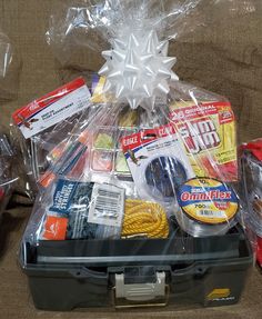 a plastic box filled with assorted items on top of a couch