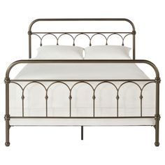 a metal bed frame with white sheets and pillows on top of it, against a white background