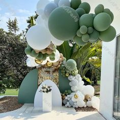 an outdoor area with balloons and greenery