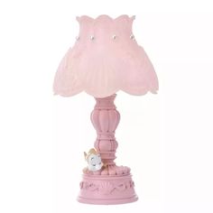 a pink lamp with a hello kitty on it