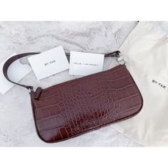 ||| Brand New ||| By Far Rachel Bag Leather: Cowhide Croc-Embossed Leather Zip At Top Dust Bag Included Lined Weight: 9oz / 0.26kg Made In Spain Measurements Height: 5in / 13cm Length: 11in / 28cm Depth: 1.5in / 4cm Handle Drop: 7.5in / 19cm Crafted From Rich, Croc-Embossed Leather In A Classic Baguette Shape; A Versatile Accessory You’ll Want To Work Into Your Daily Wardrobe. Hp By Aishve By Far Rachel Bag, Painted Leather Bag, Lace Ankle Boots, Embossed Bag, Snake Skin Bag, Patent Leather Bag, Stone Beaded Necklace, Mini Tote Bag, Brown Silver