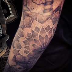 a person with a tattoo on their arm