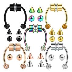 an assortment of piercings with different shapes and colors