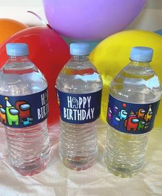 two water bottles with happy birthday labels on them