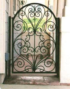 an iron gate is open to the outside