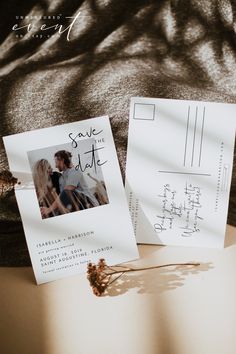 an open book sitting on top of a table next to a couple's photo