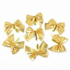 six gold bows on white background