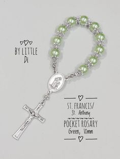 "Lovingly hand-made, high-quality Catholic mini rosaries. Perfect giveaways for your little tot's baptism. These also make meaningful wedding keepsakes... a token of gratitude to the guests who'll join your family celebration.  A universal gift for everyone who'll join you in any of your Christian events. The pocket rosary is made of glass pearls in 10mm size, carefully threaded with a beading wire and secured with metal stoppers for durability. The rosary centre and crucifix are made in Italy. Handmade Adjustable Rosary For First Communion, Handmade Silver Rosary For Baptism, Handmade Rosary Bracelet With Round Beads For Baptism, Handmade Silver Rosary Bracelet For First Communion, Handmade Silver Rosary Bracelet For Baptism, Finger Rosary, Mini Rosaries, Pocket Rosary, St Anthony