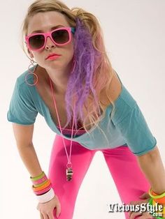 a woman with purple hair and sunglasses posing for a photo in front of a white background