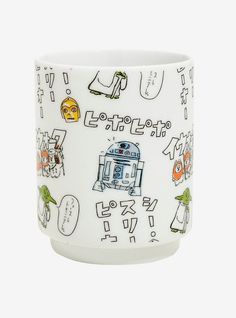 a white coffee cup with various stickers on the side and writing in korean characters