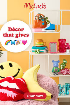 a stuffed banana sitting on top of a pink chair in front of shelves filled with toys