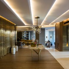 a living room filled with furniture and a chandelier