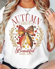 a beautiful woman wearing an autumn t - shirt