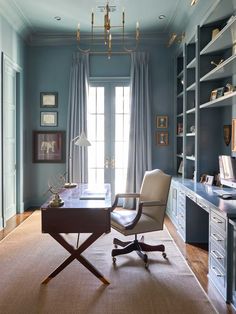 a chair and desk in a room with blue walls