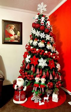 a christmas tree decorated with red and white ornaments