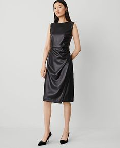 Designed with an artfully draped skirt, this luxe faux leather sheath is one of our sleekest looks. Crew neck. Sleeveless. Hidden back zipper with hook-and-eye closure. Lined body.,Hit:28" from natural waist,Imported:Imported,Fit:Hits at mid-calf,Fabrication:Shell: Imitation Leather; Coating : Polyurethane; Back : 100% Polyester;Lining : 100% Polyester,Garment Care:Machine Washable Faux Leather Sheath Dress by Ann Taylor Size regular - 14 Black Women's Fit, Flare, Faux, Leather, Suede, Regular, Ann Taylor Petite, Draped Skirt, Sleeve Dresses, Size 16 Dresses, Leather Sheath, Sleek Look, Petite Dresses, Mid Calf, Sheath Dress