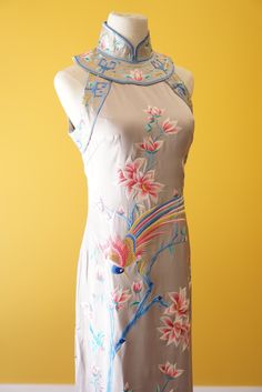 Get all the things you want in this cheongsam dress for your Chinese wedding. Comes with stunning hand embroidery of both the phoenix and peacock symbols--traditionally found on a Chinese wedding dress. This dress can be customized to your measurements as well as length. Have another design in mind? We also do bespoke designs based on your preferences and style--please check out www.eastmeetsdress.com. ✨Check out our additional dresses at www.eastmeetsdress.com✨ The Details: * Silk fabric * Beau Sleeveless Spring Wedding Cheongsam, Spring Wedding Sleeveless Cheongsam, Fitted Floral Embroidery Cheongsam For Summer, Fitted Summer Cheongsam With Floral Embroidery, Summer Floral Embroidered Fitted Cheongsam, Summer Fitted Floral Embroidery Cheongsam, Floral Print Fitted Cheongsam For Wedding, Floral Fitted Cheongsam For Wedding, Fitted Floral Cheongsam For Wedding