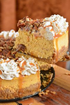 a slice of pumpkin cheesecake with pecans and whipped cream is being lifted from the cake