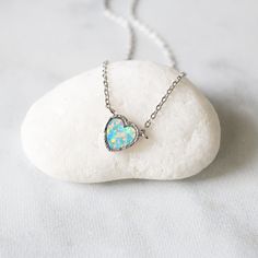 "Beautiful and lovely tiny heart charm necklace in silver color. Made of silver color setting heart blue opal stone charm with rhodium plated skinny chain. Soft and warm. Great for gift , everyday or special occasion. Your item will ship in a gift box. Please feel free to contact me if you have any question. ♥ Length 16.5\" chain ♥ Pendent 3/8\" diameter ♥ Rhodium plated over brass / Opal stone ♥ Delivery Time Fast shipping within 1 - 3 days ♥ See more Rudiana Accessories Rudiana.etsy.com" Tiny Heart Shaped Silver Necklace, Tiny Heart-shaped Silver Necklace, Nickel-free Opal Necklaces As Gift, Nickel-free Opal Necklace Gift, Silver Heart Pendant Birthstone Charm Necklace, Heart-shaped Opal Pendant Jewelry Gift, Opal Jewelry With Heart Charm As Gift, Silver Birthstone Heart Pendant Charm Necklace, Silver Opal Dainty Necklace