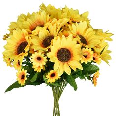 a vase filled with yellow flowers on top of a table