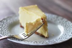 a piece of cheesecake on a plate with a fork