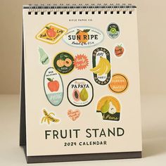 a calendar with fruit stickers on it