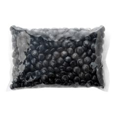 a bag of black beads on a white background