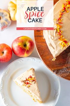 a piece of cake sitting on top of a white plate next to apples and other fruit