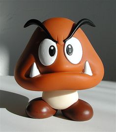 an orange and white toy sitting on top of a table