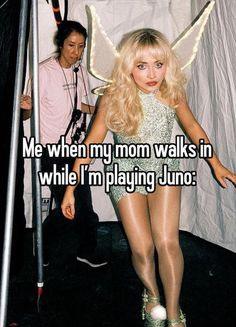 a woman in short shorts and heels standing next to a pole with the words me when my mom walks in while i'm playing juno