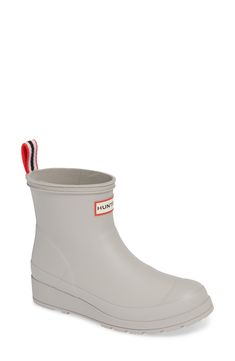 This lightweight version of a classic Hunter rain boot retains all the style and waterproof practicality of the original, in a streamlined, updated silhouette. 1 1/2" heel; 3/4" platform (size 9) 6" shaft Pull-on style Removable insole In hot or humid weather, natural latex rubber releases a protective wax film; simply wipe it off with a damp cloth A pristine finish and shine is easily restored with regular use of Hunter Boot Buffer or Instant Boot Shine Natural rubber upper/textile lining/natur Waterproof Ankle-high Rain Boots, Weatherproof Ankle-high Rain Boots, Waterproof Ankle-high Boots For Rainy Weather, Spring Waterproof Boots For Rainy Weather, Classic Waterproof Rain Boots With Round Toe, Weatherproof Ankle Rain Boots, Spring Weatherproof Boots For Outdoor Activities, Waterproof Ankle Rain Boots For Spring, Waterproof Ankle-high Boots For Spring