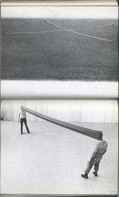 an old photo of two people playing with a large object in the snow, and one man is trying to pull it over