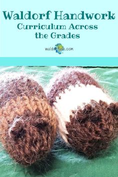 two brown and white crocheted balls sitting on top of a green cloth covered bed