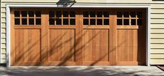 a brown garage door in front of a house