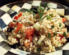 a close up of a plate of food with corn and veggies on it