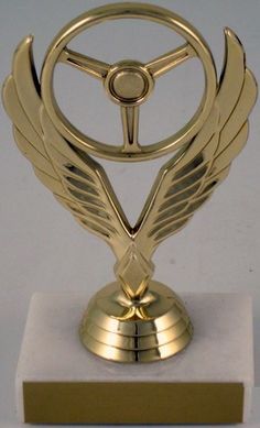 Winged Wheel Trophy-Trophies-Schoppy's Since 1921 Racing Trophy, Ada Signage, Award Design, Donor Wall, Skee Ball, Sports Medals, Crystal Awards, Trophy Design, Abstract Wallpaper Backgrounds