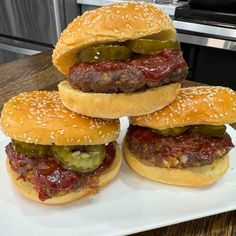 three hamburgers stacked on top of each other