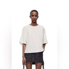 Loewe T-Shirt Colour: White Boxy Fit T-Shirt In Lightweight Cotton Jersey. Oversized Fit Short Length Crew Neck Asymmetric Front To Back Side Slits Anagram Embroidery Placed On The Chest Modern Oversized T-shirt, Boxy Drop Shoulder Summer Tops, Boxy Drop Shoulder Tops For Summer, Chic Boxy Fit Crew Neck Top, Chic Oversized Crew Neck T-shirt, Chic Boxy Short Sleeve Tops, Chic Oversized Short Sleeve T-shirt, Black Silk Top, Blue Denim Shirt