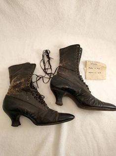 "Wonderful note with these boots - worn by Mom in 1913. Authentic Victorian era lace up boots, condition okay - with wear and age but still intact with integrity. Label is Physical Culture Shoes For Style and Ease Em Henne Co. Brooklyn N.Y.. Sold at M Myers & Son New Haven. See photos for wear - worst area back of the right boot where there is a loss of surface and some small tears to leather. Not tiny in size, footbed from the outside 10 3/4\", 2 3/4\" wide, heel height 2.5\" shaft height 9 Vintage Fitted Boots With Laces, Vintage High Heel Lace-up Boots For Fall, Vintage Lace-up Pointed Toe Boots For Fall, Vintage Pointed Toe Lace-up Boots For Fall, Victorian Boots With Leather Sole, Vintage Black Lace-up Heeled Boots, Vintage Lace-up Boots With Reinforced Heel, Vintage Lace-up Boots With Pointed Toe And Leather Sole, Historical Formal Boots With Round Toe