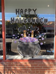 there is a sign in the window that says happy halloween