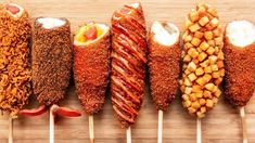 five skewers filled with different types of food