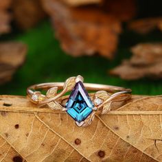 a blue ring with leaves surrounding it