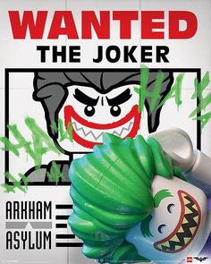 a lego batman character with green hair and fangs on it's head, standing in front of a sign that says wanted the joker