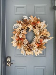 a wreath is hanging on the front door