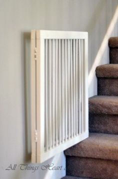 a white radiator sitting on top of a set of stairs